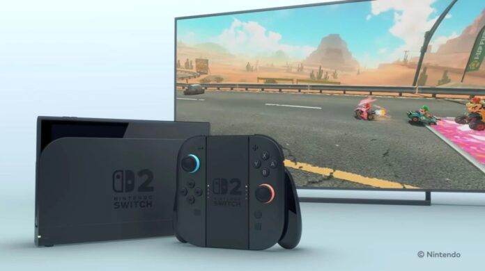 ภาพเครื่องเล่นเกม Nintendo Switch 2 สีดำวางอยู่ด้านหน้าโทรทัศน์ที่กำลังแสดงเกม Mario Kart บนหน้าจอ โดยมีจอยคอนโซล Joy-Con วางแนบอยู่กับแท่นจับ