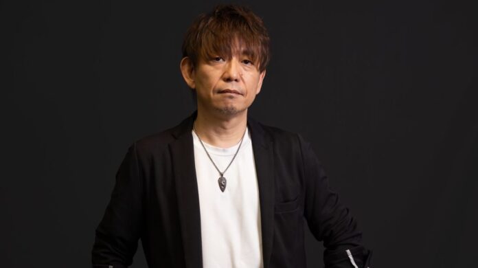 ภาพ Naoki Yoshida ในชุดสูทสีดำทำหน้าจริงจัง