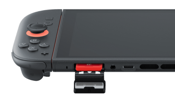 เครื่องเกมพกพา Nintendo Switch 2 พร้อมการ์ดเกมสีแดงเสียบอยู่ในช่อง
