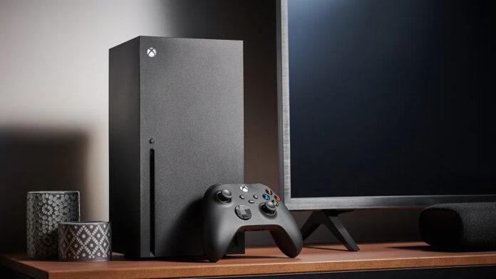 เครื่อง Xbox Series X พร้อมจอยคอนโทรลเลอร์วางข้างจอทีวีบนโต๊ะไม้