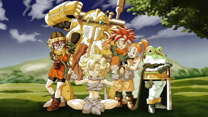 งานภาพ Chrono Trigger แสดงตัวละครหลักอย่าง Crono, Marle, Lucca และ Frog ยืนรวมกันกลางฉากกลางแจ้ง พร้อมเครื่องจักรขนาดใหญ่อยู่ด้านหลัง