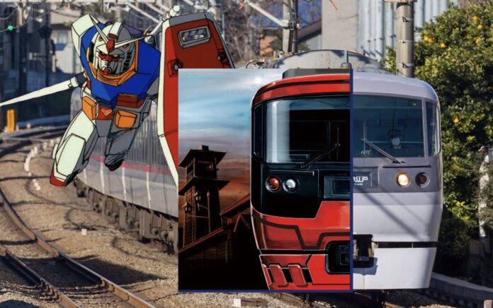 รถไฟญี่ปุ่นวิ่งบนราง โดยมีภาพหุ่นยนต์ Gundam อยู่ด้านข้าง