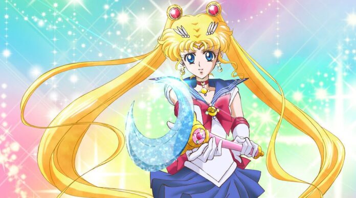 Sailor Moon ยืนถือคทาพร้อมพระจันทร์เสี้ยว พื้นหลังสีพาสเทลมีประกายแสง