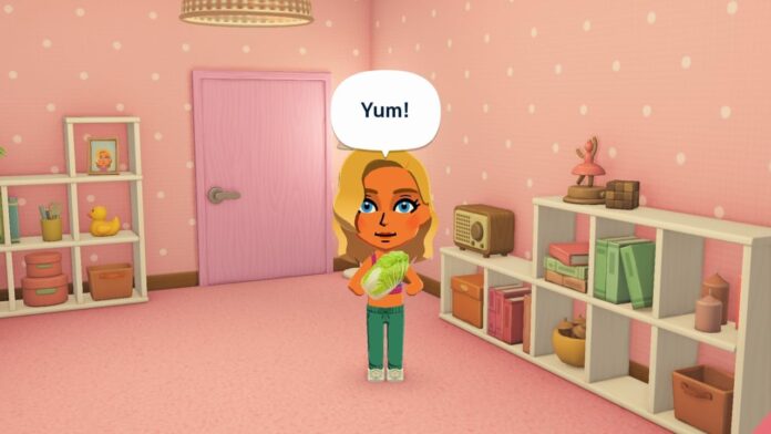 ตัวละครจากเกม Tomodachi Life ยืนอยู่ในห้องสีชมพู พร้อมกล่องข้อความคำว่า “Yum!”