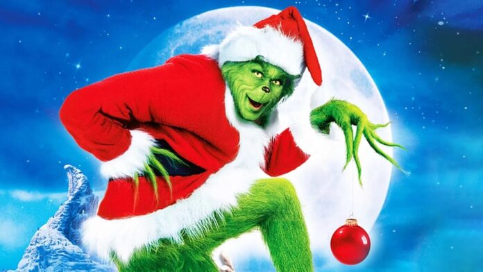 Jim Carrey ในบท Grinch สวมชุดคริสต์มาสสีแดง