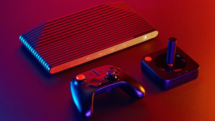 เครื่องเกมคอนโซล Atari VCS พร้อมจอยแพดและจอยสติ๊กในแสงไฟนีออน